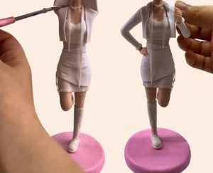 Handcrafting a custom clay figurine – assembling arms and clothing details