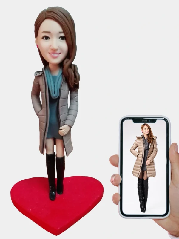 Custom clay figurine of an elegant woman in winter coat – front view