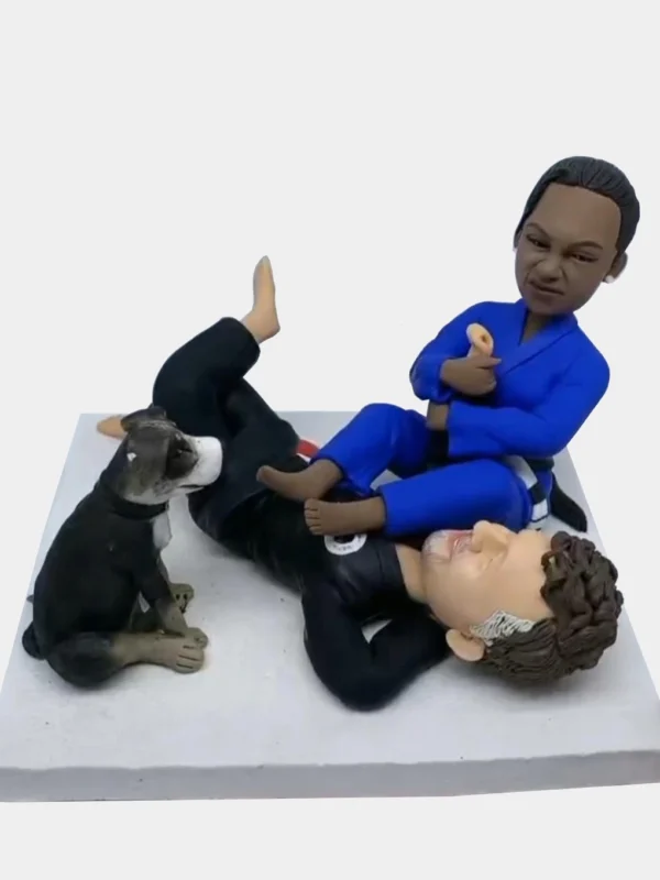 Custom clay figurine of a couple and their pet dog in a funny pose – personalized handmade sculpture.