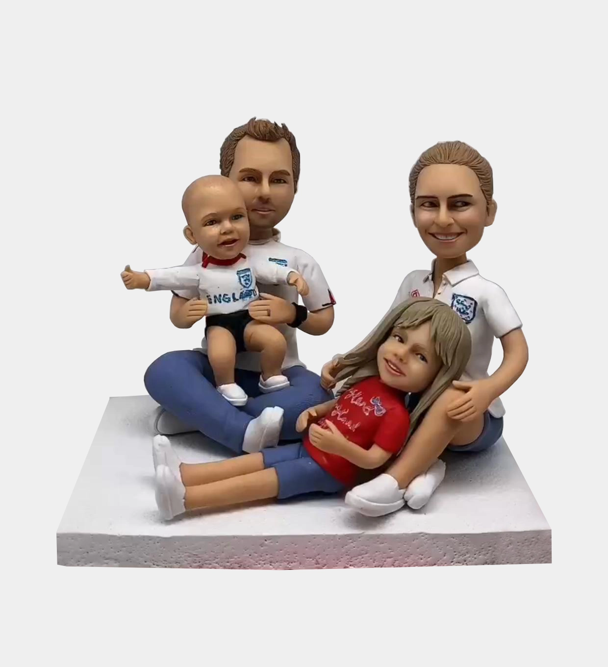 Custom clay figurine of a happy family of four – front view