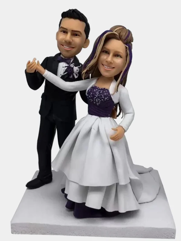 Custom clay figurine of a couple dancing in wedding attire