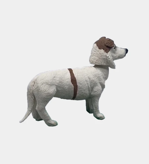 Right side view of a custom clay dog figure with white and brown markings